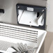 A white basket with silverware in a Campus Products cutlery dryer.