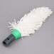 A white mop with a green handle.