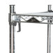 A Metro chrome wire shelving unit with 2 metal legs and 4 shelves.
