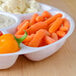 A white Fineline 5-compartment tray with baby carrots, cauliflower, and dip.