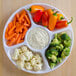 A Fineline white plastic tray with 5 compartments holding baby carrots and broccoli with dip.