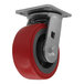 A Channel CPS25U polyurethane swivel plate caster with a red rubber tire.