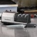 A black Edgecraft Chef's Choice 3 Stage Diamond Hone professional knife sharpener on a counter.