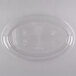 A clear plastic oval catering tray with a circular design.