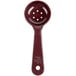 A reddish brown plastic Carlisle short handle perforated portion spoon.