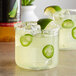 Two glasses of DaVinci Agave syrup margaritas with salted rims and lime slices.
