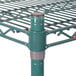 A green Metroseal 3 wire shelving unit with metal poles.