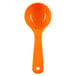A Carlisle orange plastic spoon with a short handle.