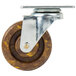 A close-up of a Channel CPS54H high-temp swivel plate caster wheel. A metal wheel with brown and chrome parts.