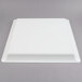 A white square Fineline plastic catering tray with a lid on top.
