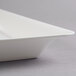 A white plastic square Fineline Cater Tray.