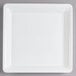 A Fineline white plastic square catering tray with a small hole in the middle.