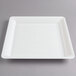 A white square Fineline catering tray with a clear lid on it.