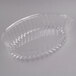A clear plastic oval lid with a handle.