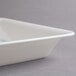 A white Fineline rectangular plastic catering tray with a lid.