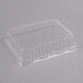 A clear plastic rectangular dome lid on a clear plastic container.
