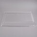 A clear plastic Fineline rectangular dome lid on a clear plastic tray.