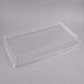 A clear plastic container with a clear plastic rectangular dome lid.
