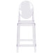A Flash Furniture clear plastic counter height stool with an oval back.