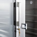 The glass door of a Continental D2RENSSGDHD reach-in refrigerator with a key lock on it.