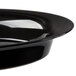 A close up of a Fineline black plastic oval catering bowl.