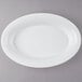 A white oval plastic catering bowl.