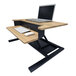 A Luxor white oak two-tier desktop desk with a laptop on the top shelf and a keyboard on the bottom shelf.