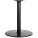 A BFM Seating black round table base with a round pedestal.