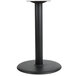 A BFM Seating black stamped steel round table base with a column.