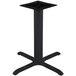 A BFM Seating black stamped steel counter height table base with four legs.