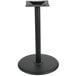 A BFM Seating black round table base with a black pole.