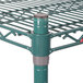 A Metroseal 3 green metal wire shelving unit with metal poles.