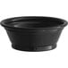 A black Choice plastic souffle cup on a white surface.