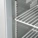 A white Beverage-Air worktop refrigerator with shelves.