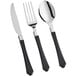 A close-up of Visions black handled plastic cutlery with silverware and black handles.