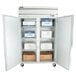 A Beverage-Air Horizon Series reach-in freezer with shelves and boxes inside.