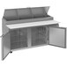 A stainless steel Beverage-Air refrigerated counter with two open doors.