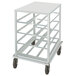 A white metal cart with black wheels and four shelves.