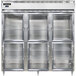 A Continental stainless steel reach-in freezer with three glass half doors.