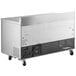 A large stainless steel Avantco worktop freezer with wheels.