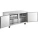 A stainless steel Avantco undercounter freezer with two doors open.