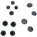 A group of black round rubber hole covers with screws.