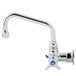 A silver T&S wall mounted faucet with a blue 4-arm handle.