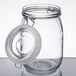 A Choice clear glass jar with a hinge top lid and metal ring.