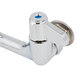 A silver Equip by T&S wall mounted faucet base with blue lever handles.