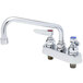 A chrome T&S deck-mounted workboard faucet with lever handles and a swing spout.