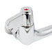 A chrome Equip by T&amp;S wall mounted faucet base with lever handles.