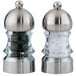 A Chef Specialties salt and pepper mill set with silver tops.