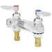 A T&S deck mounted lavatory faucet with two lever handles.