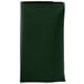 A folded hunter green Intedge cloth napkin.